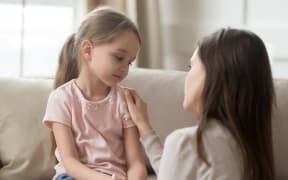 Loving worried mom psychologist consoling counseling talking to upset little child girl showing care give love support, single parent mother comforting sad small sullen kid daughter feeling offended