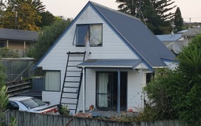 The Tauranga property where police shot a man they say had threatened a woman and child with a machete today.