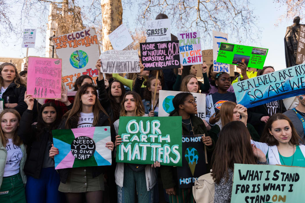Thousands of young people gather in Parliament Square in central London to protest against the governments lack of action on climate change.