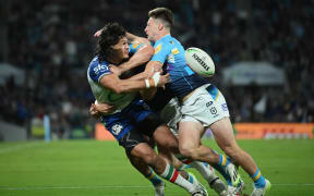 Dallin Watene-Zelezniak gets his pass away to Shaun Johnson against the Titans, 2023.