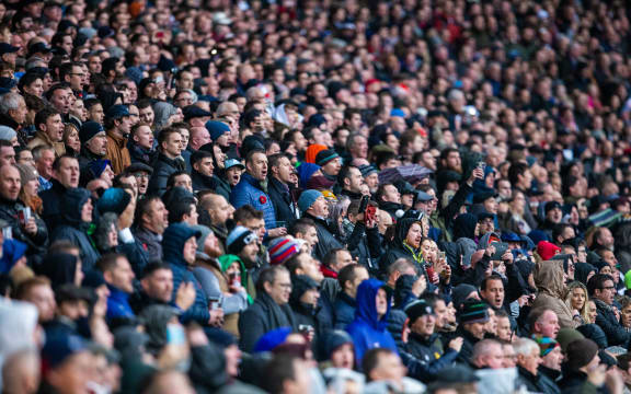 Rugby fans sing at Twickenham.