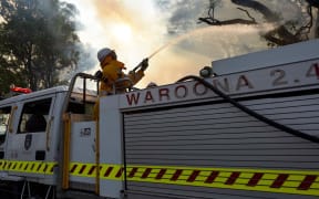 Firefighters battling a fire near Waroona in Western Australia.