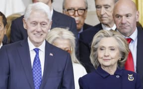 Former US President Bill Clinton (L) and former US Secretary of State Hillary Clinton (R) attend the inauguration ceremony where Donald Trump will sworn in as the 47th US President in the US Capitol Rotunda in Washington, DC, on January 20, 2025. (Photo by Shawn THEW / POOL / AFP)