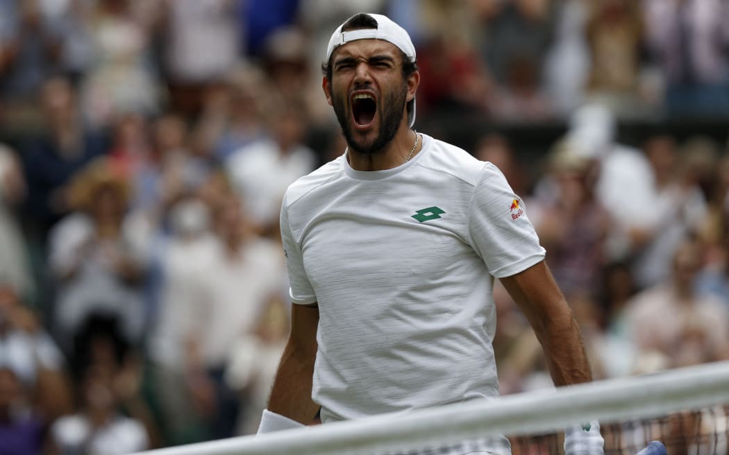 Italy's Matteo Berrettini celebrates his win against Poland's Hubert Hurkacz during their men's singles semi-final match on the eleventh day of the 2021 Wimbledon Championships at The All England Tennis Club in Wimbledon, southwest London, on July 9, 2021.