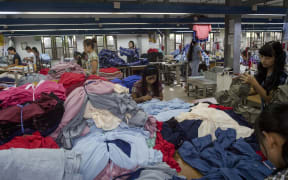 Labourers work at a garment factory in Yangon, Myanmar