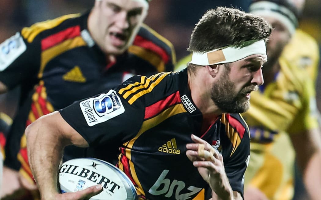 The Chiefs' Mike Fitzgerald makes a break during the Super 15 Rugby match.