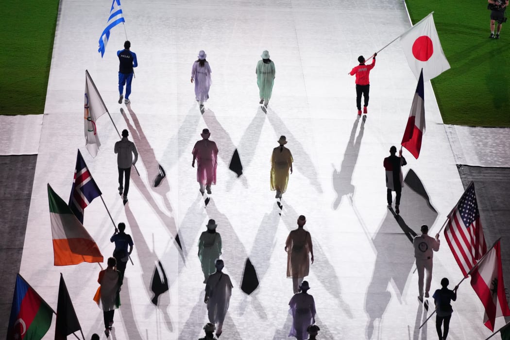 Flag bearers with their national flags enter during the closing ceremony at Tokyo Olympic Games in National Stadium in Tokyo.