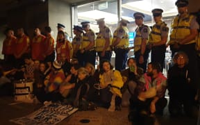 Protesters outside the NZ Minerals Forum in Dunedin.