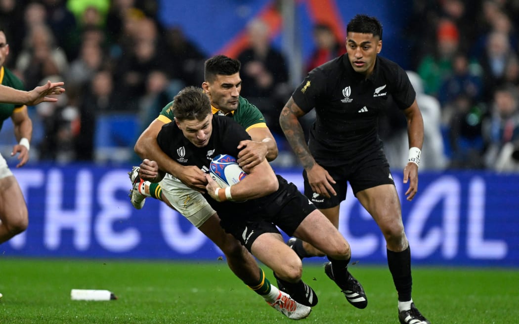 Beauden Barrett in tackled during the Rugby World Cup final between the All Blacks and South Africa at Stade de France.