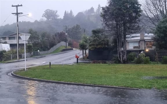 Water pooling on Eighty Eight Valley Road in Wakefield as rain arrives in the Nelson-Tasman region.