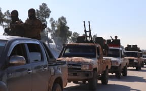 Hamza Division, a member of the Turkey-backed Free Syria Army (FSA), dispatch fighters and armored vehicles to the Manbij border line in Syria's Al-Bab town on December 28, 2018.