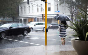 Rain pours down in the Auckland CBD.