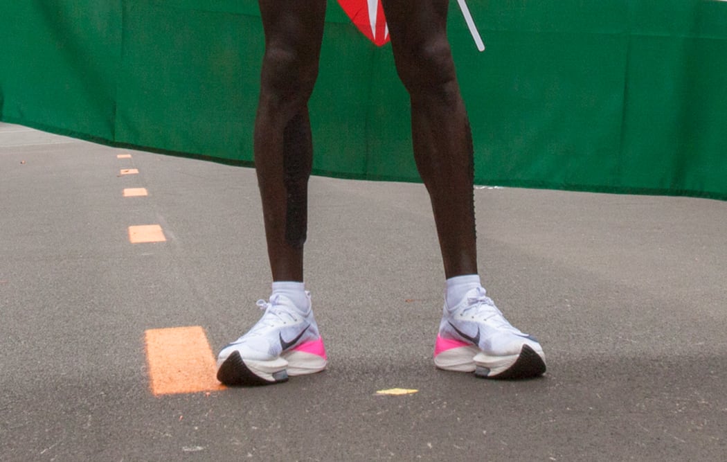 Eliud Kipchoge stands after the marathon record.