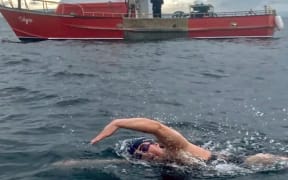 Marathon swimmer, cellist, and librarian, Corrina Connor mid-swim.