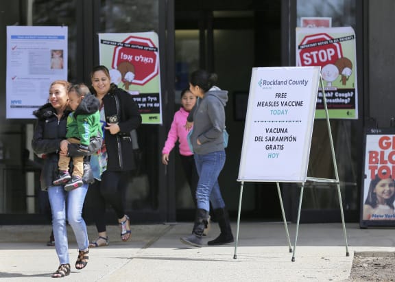 Signs advertising free measles vaccines and information about measles are displayed at the Rockland County Health Department, in Pomona, N.Y.