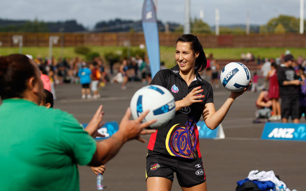 Magic players, Jo Trip warms up with the winning Warm Up team, Tuhoe. Waikato Bay of Plenty Magic, ANZ Championship Roadshow, Westbrook Netball Complex, Rotorua, New Zealand. Saturday, 26 April 2014,. Photo: John Cowpland / photosport.co.nz