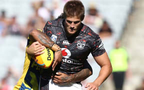 Blake Ayshford of the Warriors is tackled by an Eels player at the Auckland Nines.