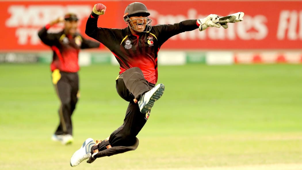 PNG keeper Kipling Doriga celebrates a wicket