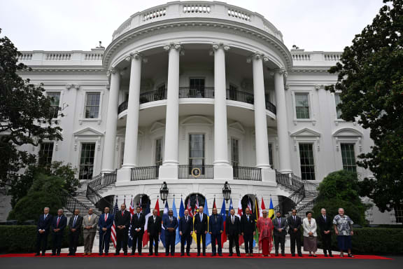 US President Joe Biden (C) stands for a group photo with Pacific Islands Forum leaders following the Pacific Islands Forum (PIF) Summit, at the South Portico of the White House in Washington, DC, on September 25, 2023 (Photo by Jim WATSON / AFP)
