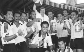 Manager Marina Schaafhausen holds winning Cup as Moata'a celebrate victory at Singapore Sevens.
