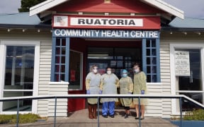 Staff at Ruatoria community health centre with the face shields made by  Te Kura Kaupapa Māori o Te Waiu o Ngāti Porou.