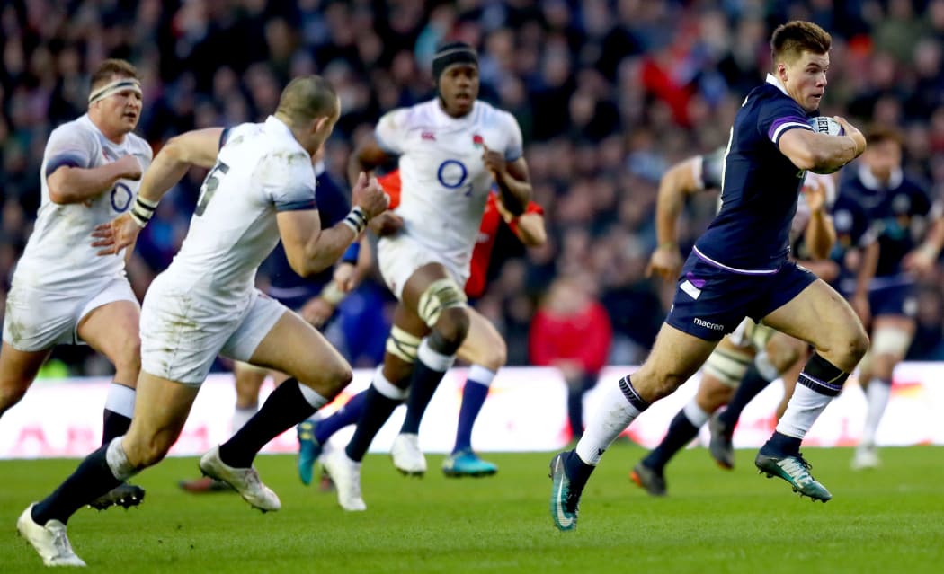 Scotland's Huw Jones breaks free against England.