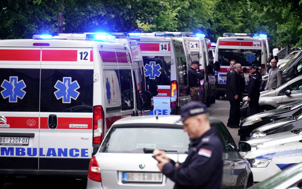 Ambulances and police officers arrive following a shooting at a school in the capital Belgrade on May 3, 2023. - Serbian police arrested a student following a shooting at an elementary school in the capital Belgrade on May 3, 2023, the interior ministry said. The shooting occurred at 8:40 am local time (06:40 GMT) at an elementary school in Belgrade's downtown Vracar district.
