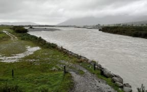 Supplied/West Coast Regional Council

[Wanganui stopbank damage] A view upriver towards the State Highway 6 bridge following the August storm which took out chunks of the northern bank stop bank, left.