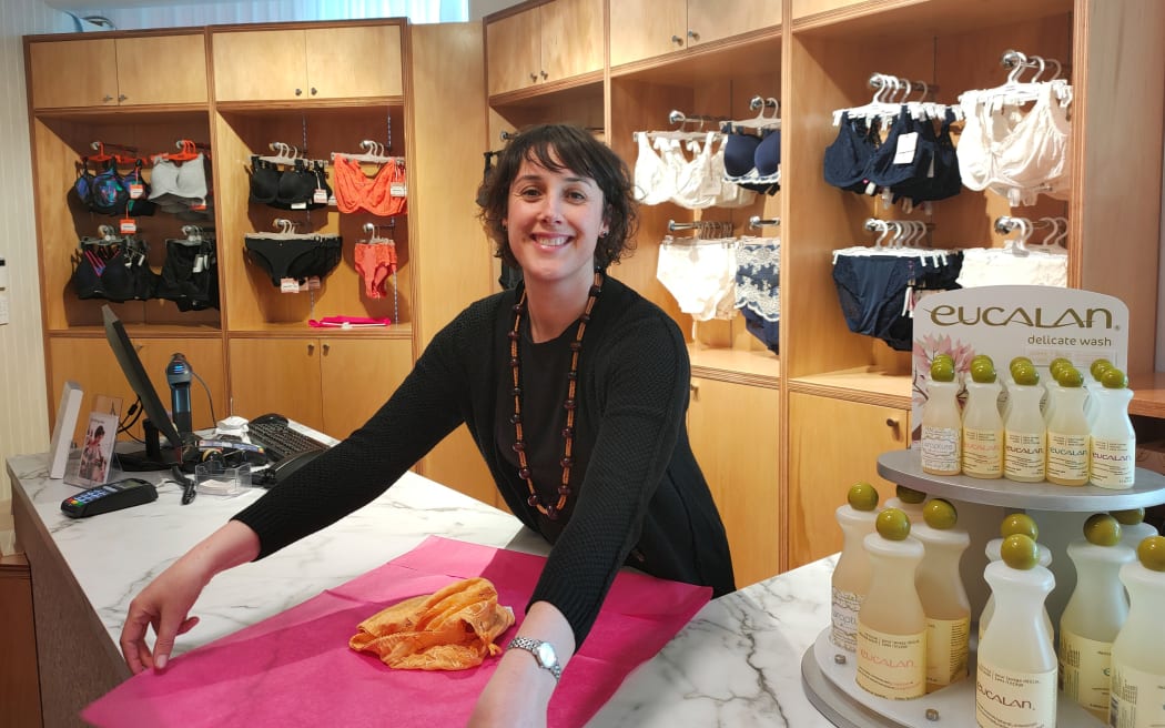 Deborah Lewthwaite, expert swimwear salesperson and general manager of The Fitting Room, stands at the counter of one of her swimwear and underwear shops.