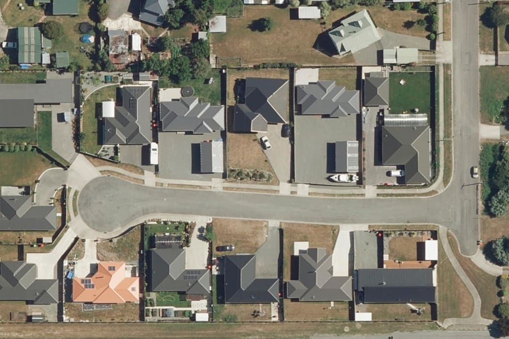 An aerial shot of properties in Renwick shows the differences in grass colours.