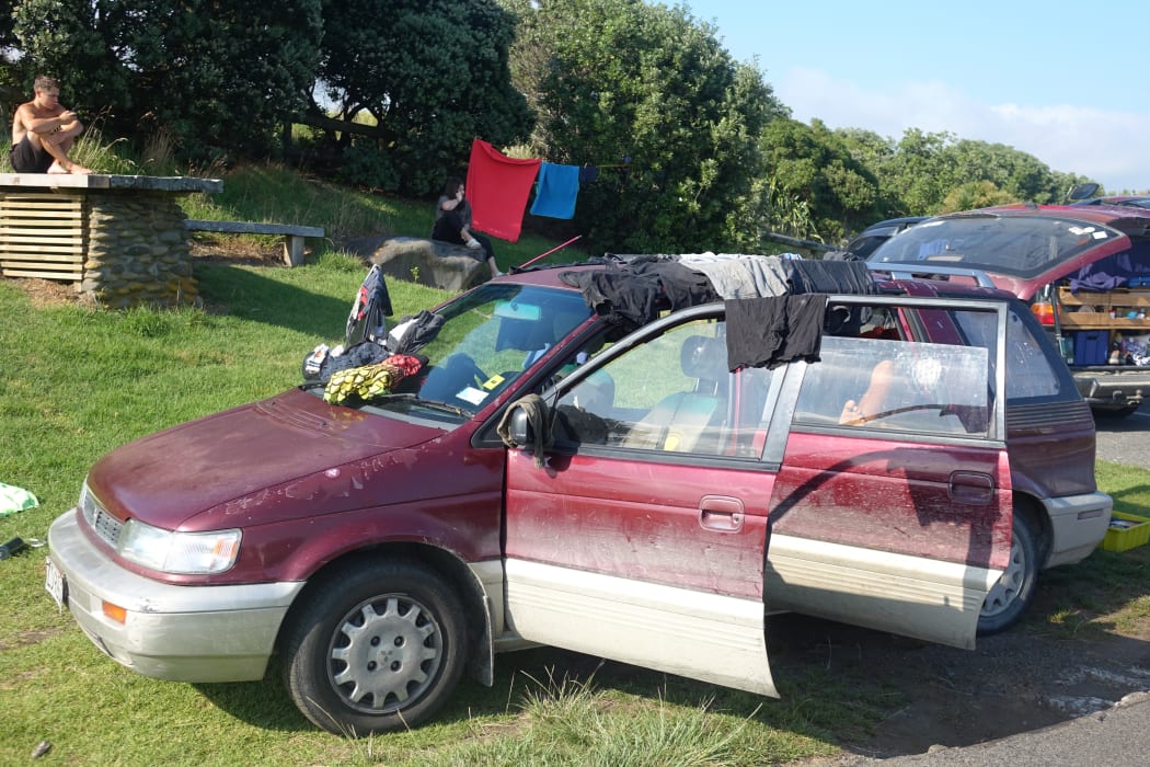Washing strewn over a freedom campers' vehicle.