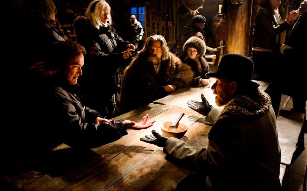 Director Quentin Tarantino (left) works with his cast on the set of The Hateful Eight