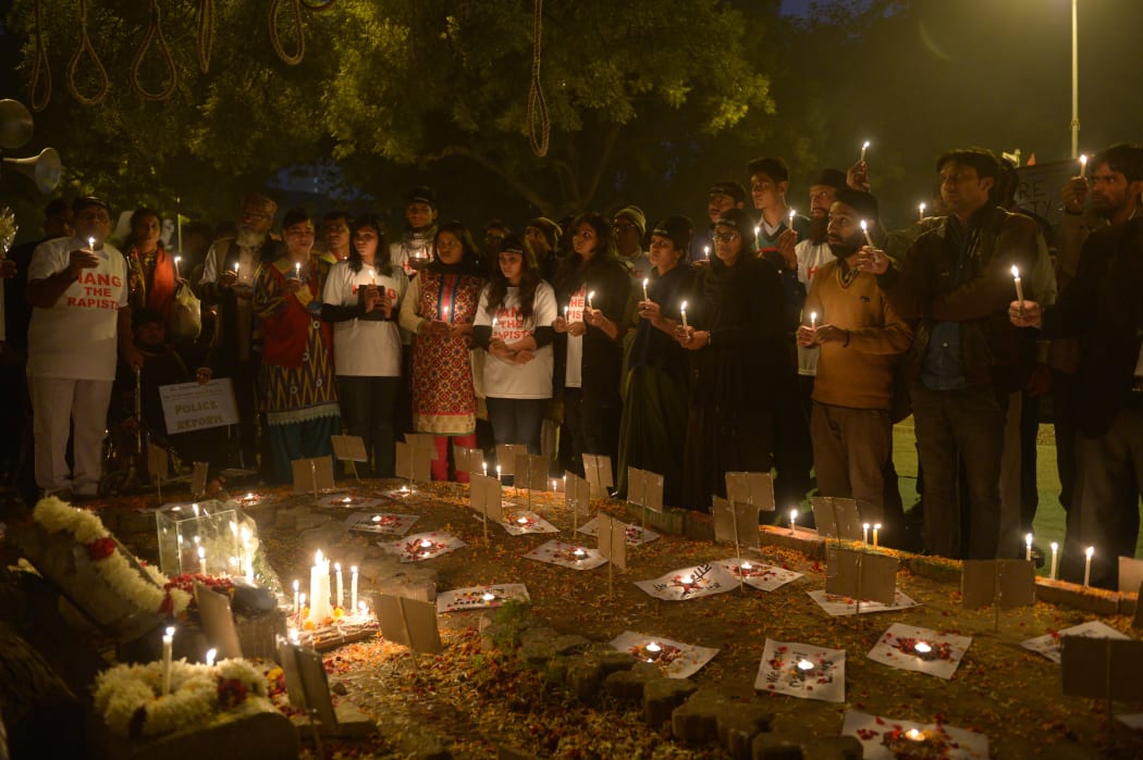 Activists mark the second anniversary of the fatal gang-rape of a Delhi student.