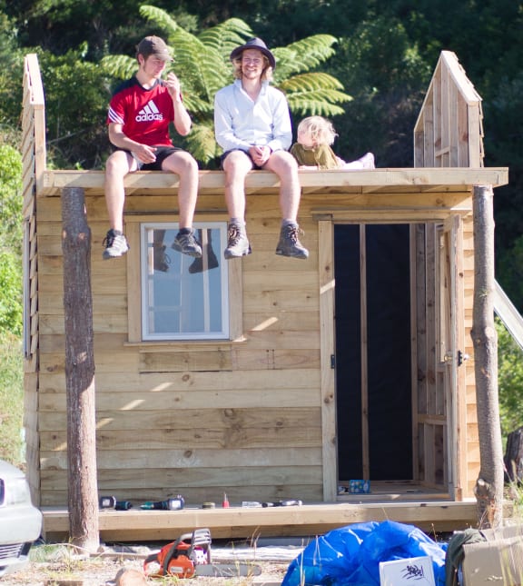 Luke Concannon's, left, tiny house under construction.