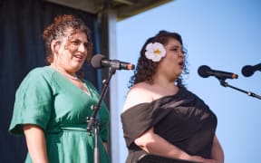 From left: singers Michaela Cadwgan and Katherine Winitana performing in Opera in the Park 2026.