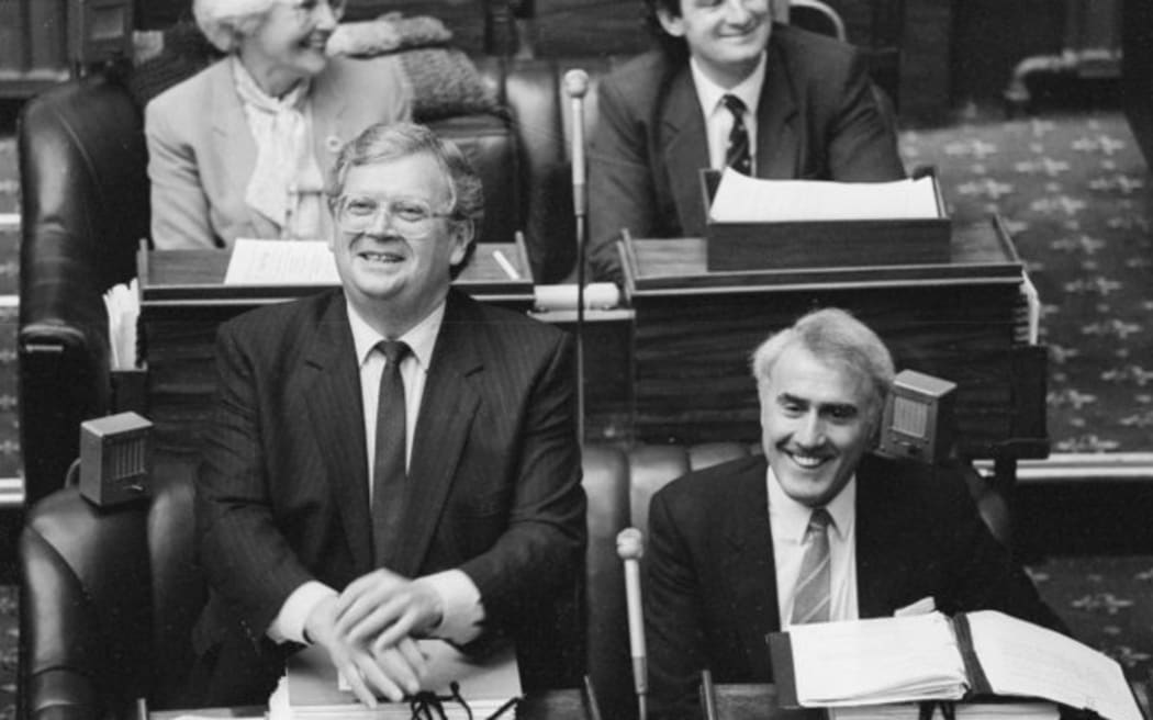 The day David Lange (left) steps down as Prime Minister. His successor Geoffrey Palmer (right) sits beside him, 1989.
