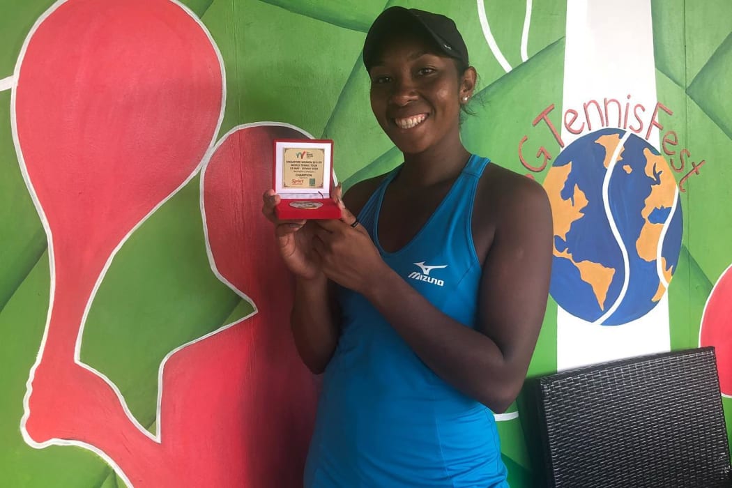 PNG's Abigail Tere-Apisah celebrates her win at the US$25,000 singles event in Singapore.