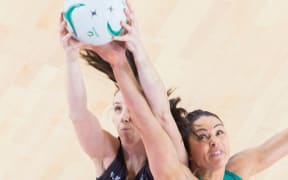 Silver Ferns shooter Bailey Mes battles for the ball against Australian Sharni Layton 2016.