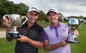 Australia`s Matthew Millar with the Winners Cup, left, and New Zealand`s Josh Geary with the Sir Bob Charles Cup for being the leading New Zealander at the NZ PGA Championship, Remuera Golf Club, March 08, 2015.