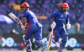 Najibullah Zadran (L) and captain Mohammad Nabi of Afghanistan during 2021 T20 World Cup.