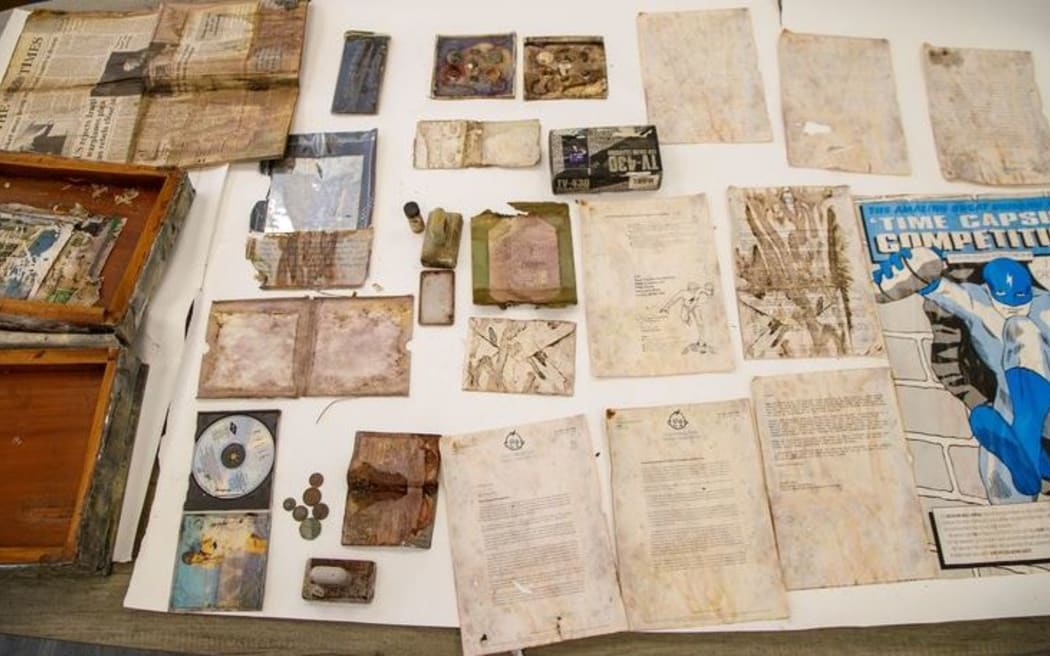 Time capsule items included a pocket television, a solar-powered calculator, a collection of British coins, some tree seeds in a bottle, a snowflake hologram, a sheet of recycled paper, a European passport and a Kylie Minogue CD.