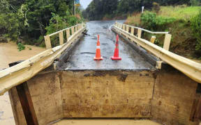 The Ngaiotonga Bridge itself is undamaged but the approach has been washed out. Photo: Supplied / Whangaruru North Residents and Ratepayers Association