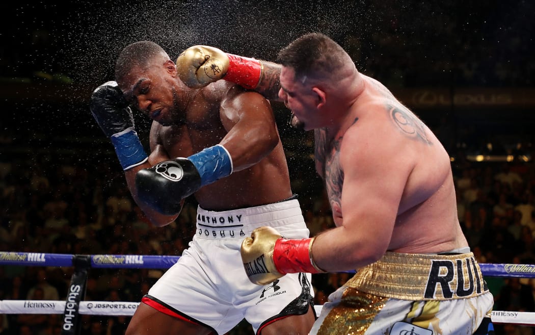 Andy Ruiz Jr (R) lands a blow to the head of Anthony Joshua in their World heavyweight title fight in New York.
