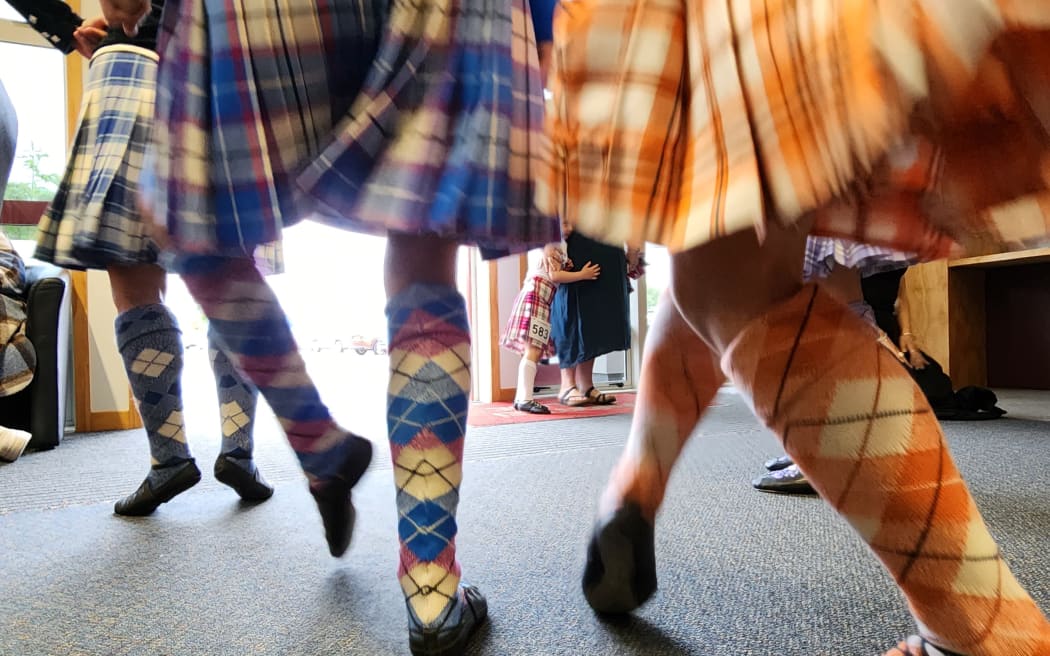 Highland dancers warm up before their competition