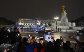 The coffin of Queen Elizabeth II arrives in the Royal Hearse at Buckingham Palace in London, 13 September 2022.