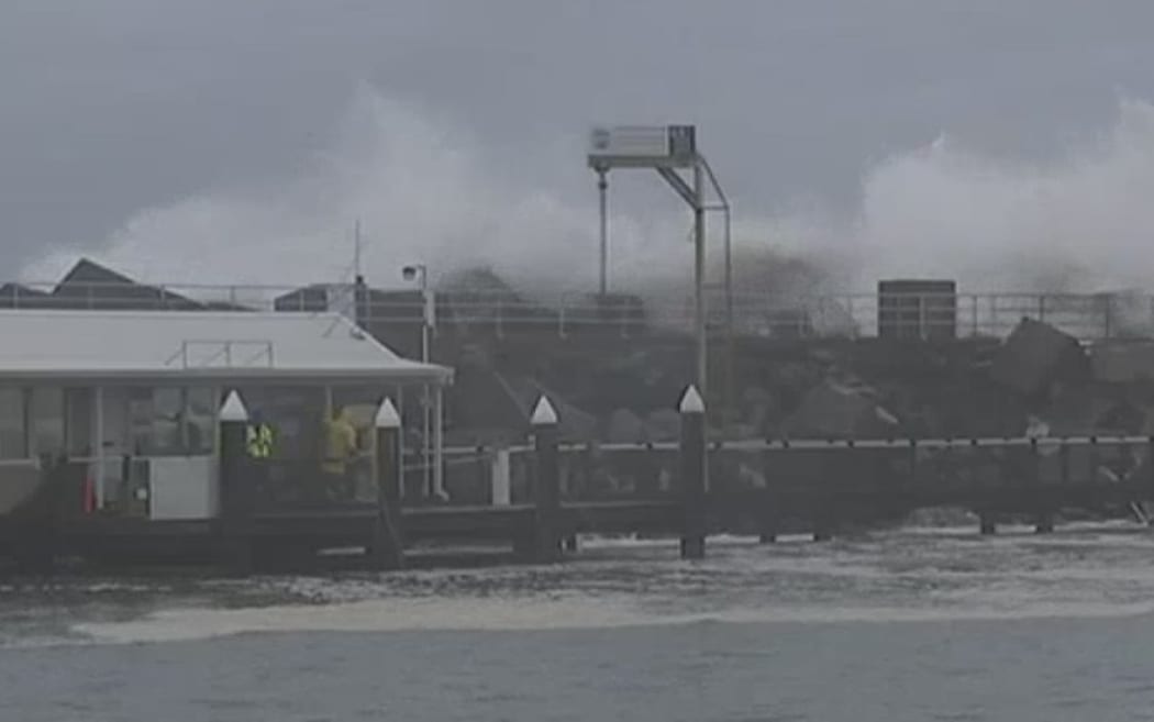 Coffs Harbour, where some were trapped on boats after a boardwalk was badly damaged.