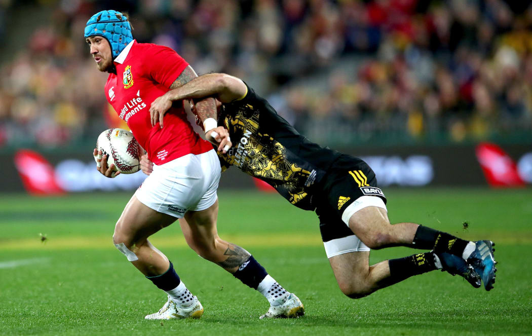 The Lions' Jack Nowell and Nehe Milner-Skudder of the Hurricanes.