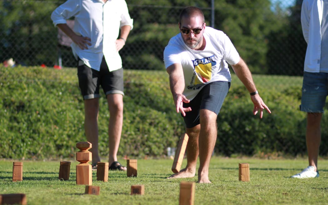 A Kubb player in action.
