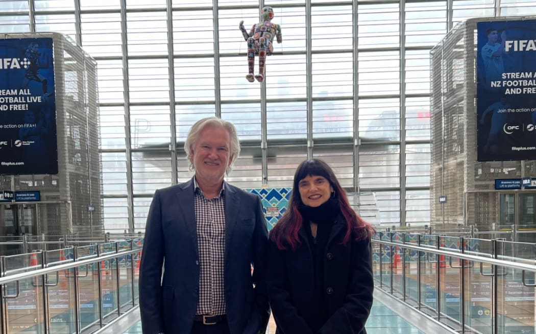 Radius Care Executive Chair Brien Cree, Artist Mandalina Stanisich, with art installation "Safety Net" in Auckland's Britomart train station.
