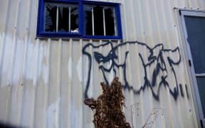 Vandalism with the letters FTW, which stands for F*** The World, shows the hopelessness felt by local youths.